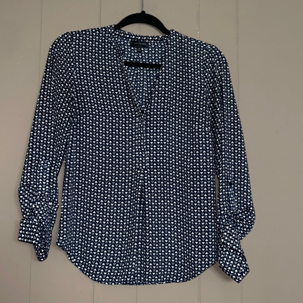 Blue blouse with white geometric designs